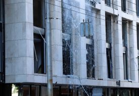 Broken windows in a house after night shelling in Kyiv