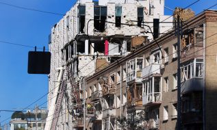 Broken windows in a houses after nighttime shelling in the Shevchenkivskyi district of Kyiv