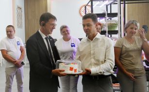 Vasyl Bilogura presents Felix Baumann with a sweet gift for embassy employees