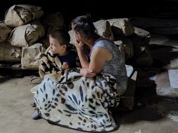 Woman with boy in shelter