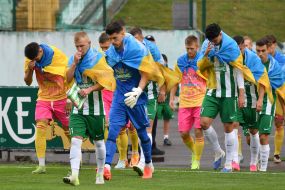 Players take to the field before the match