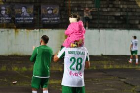 Players of FC Karpaty (Lviv) thank fans near portraits of fallen military on the stand