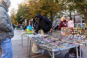 A man sells small souvenirs on the street in central Kyiv