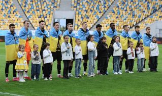 Players of FC Rukh (Lviv) perform the anthem of Ukraine
