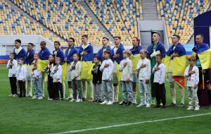 FC Shakhtar Donetsk players perform the Ukrainian anthem