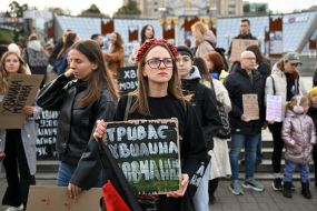An activist during a moment of silence in Kyiv.
