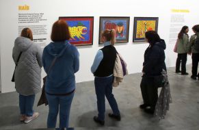 Visitors near the works of Ukrainian People's Artist Maria Prymachenko