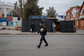 A bus stop in Kherson, fenced off with a special fence.