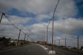 Anti-drone nets over a road in Kherson