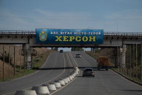 Road sign "You are welcomed by the hero city of Kherson" at the entrance to the city