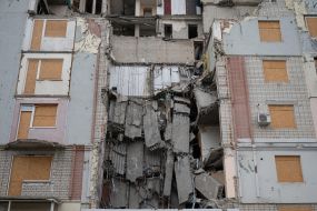 A partially destroyed residential building in Kherson