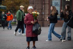 An elderly woman with flowers