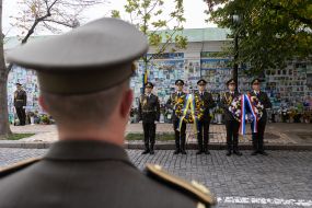 An honor guard lays wreaths at the Wall of Remembrance for the Fallen Defenders of Ukraine.