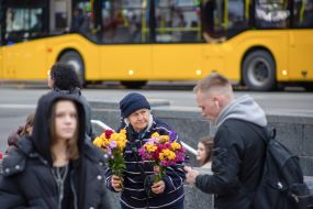 An elderly woman with flowers