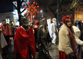 Participants of the Christmas Nativity Scene sing carols