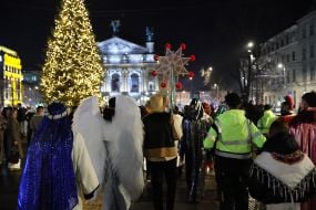 Participants of the Christmas Nativity Scene sing carols