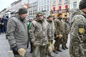 Military personnel and veterans during a festive procession