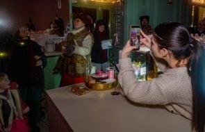 Caricature artists congratulate people on Christmas in Kharkiv