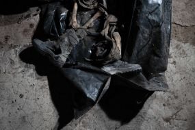 Volunteers of the search organization "Platsdarm" examine the remains of Ukrainian and Russian soldiers in the Donetsk region