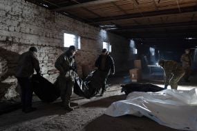 Volunteers of the search organization "Platsdarm" examine the remains of Ukrainian and Russian soldiers in the Donetsk region