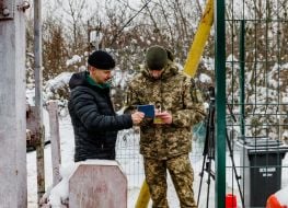 Border guard checks passport
