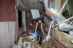 Rescuers search for victims in a boarding school building