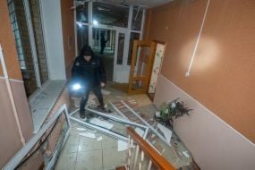 Police officer in a boarding school building