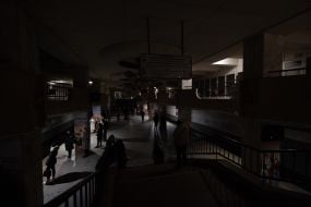Passengers in the dark during an emergency power outage on the platform of the Akademmistechko metro station in Kyiv