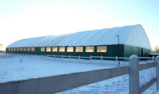 Indoor horse riding arena for dressage