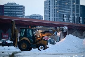 A tractor clears the street of snow in Kyiv