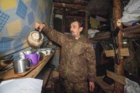 Artilleryman in a dugout on the Ukrainian-Russian front line in the Kharkiv region