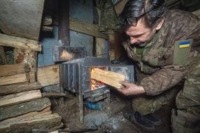 Artilleryman in a dugout on the Ukrainian-Russian front line in the Kharkiv region