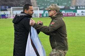 Francisco Fernandez salutes a serviceman