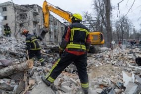 Search and rescue operations at the site of a Russian missile hitting a five-story residential building in the Kyivskyi district of Kharkiv