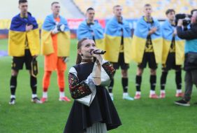 Young singer Milana Kovalevich performs the national anthem of Ukraine