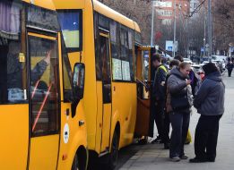 People get on a minibus
