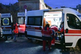 Ambulance doctors provide assistance to people after Russian drone attack in Lviv