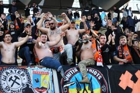 Fans of FC Shakhtar (Donetsk), including veterans, in the stands