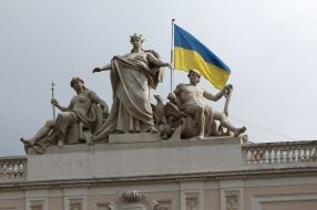 The Ukrainian flag is held by the central figure of Galicia in the sculptural group "Genius of the Fatherland"