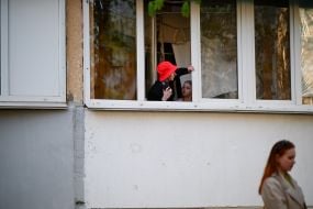 People on the balcony of the house where the terrorist lived and set fire to the apartment