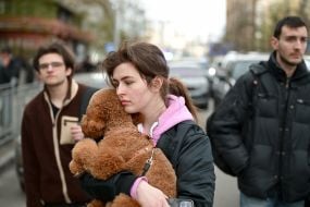 Woman with a dog in her arms