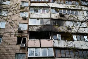 The charred facade of the house where the terrorist lived and set fire to the apartment