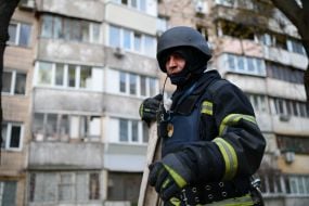 Rescuer near the house where the terrorist lived and set fire to the apartment