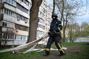 Rescuer near the house where the terrorist lived and set fire to the apartment