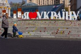 Woman with child on Independence Square