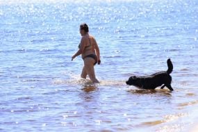People relax on the beach in Natalka Park in Kyiv