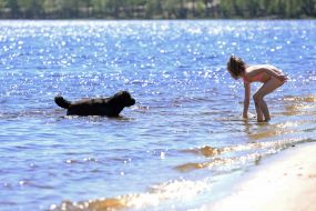 People relax on the beach in Natalka Park in Kyiv