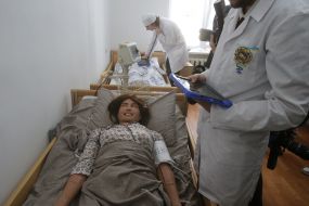 A students at a practical session in a room equipped with simulators