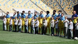 Players of FC Rukh (Lviv) and FC Oleksandria during the performance of the Ukrainian anthem