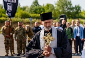 Clergymen conduct a funeral service during the solemn ceremony of meeting the coffins with the ashes of UNR Army Colonel and OUN leader Andriy Melnyk